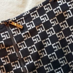 St. John Collection metal front zip skirt. Above the knee. A-line fit.